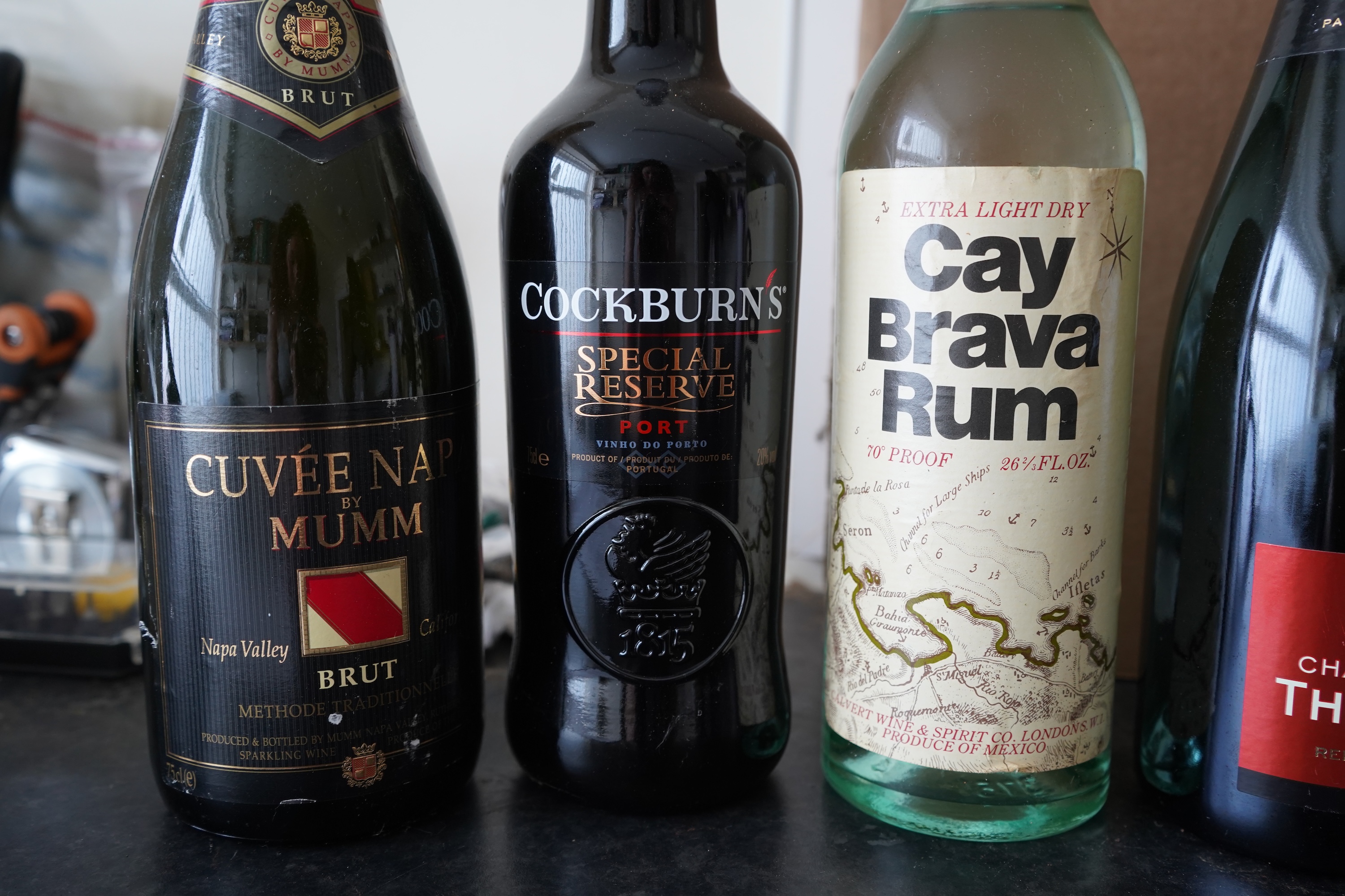 Eight bottles of champagne, port and rum to include Mumm, Laurent Perrier and Warres